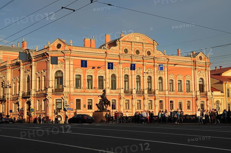 Historic Baroque building, Beloselsky-Belozersky Palace, with sculpture on busy street in daylight, Saint Petersburg, St. Petersburg, Russia