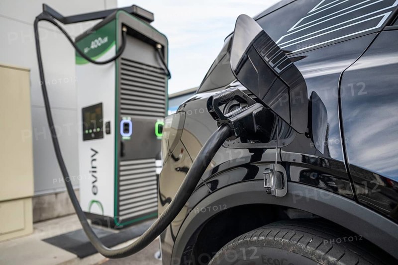 Fully electric Ford Explorer charging cable in electric tank Eviny electric vehicle charging station Norway