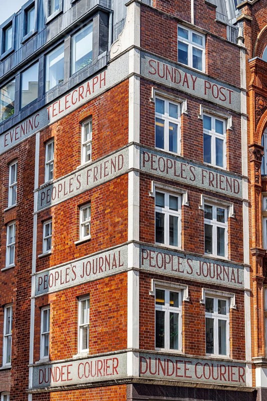 Carved stone lettering for titles including the Evening Telegraph, Sunday Post, People's Friend, People's Journal and Dundee Courier decorates the corner of 185 Fleet Street, long connected with the Dundee publisher John Leng and Co and its successor D.C. Thomson and Co. London, England, United Kingdom