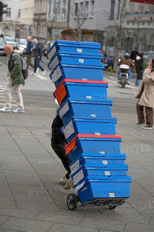 Transportation of pharmaceutical containers through the pedestrian zone, Linz, Austria