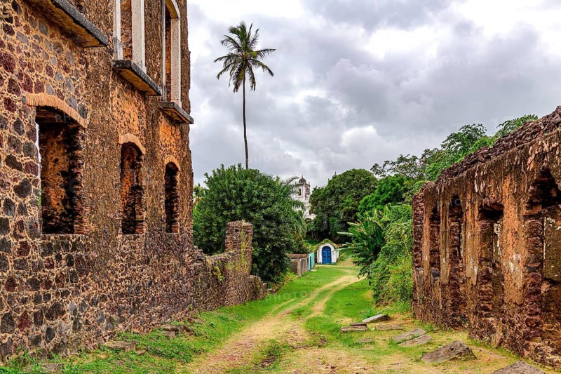 Street lined with stone ruins in the historic city of Alcantara, Maranhao, Alcantara, Maranhao, Brazil