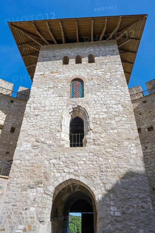 Close-up of medieval tower with stone walls and arched windows under blue sky, Soroca Fortress, Soroca, Republic of Moldova, Moldova