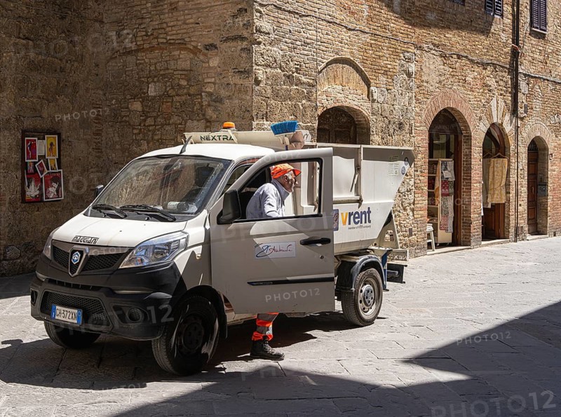 City cleaning employee with his vehicle, Pienza, Tuscany, Italy