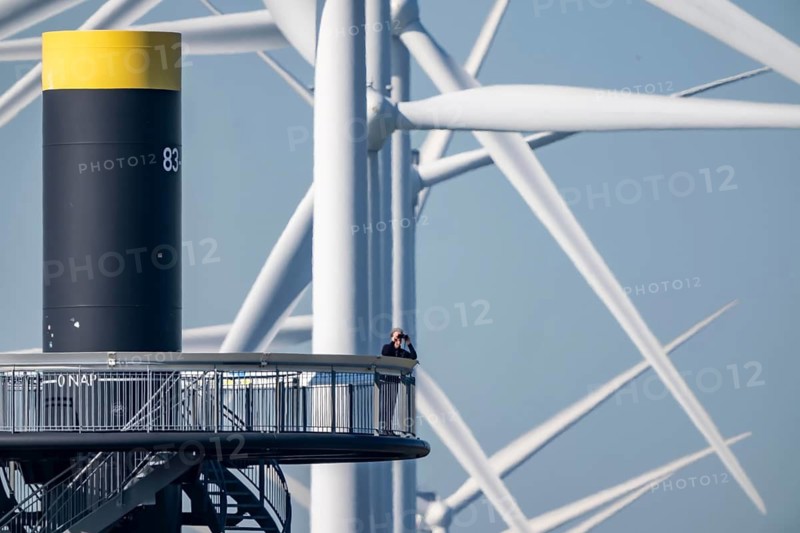 Viewing platform at Landtong Rozenburg wind farm, Noordzeeweg, Paal 83 watchtower 22 meters high, behind it 11 Vestas wind turbines, with an output of 34 MW and an annual result of 117 gigawatts, which corresponds to the consumption of approximately 43, 000 households, on a promontory on Nieuwe Waterweg, at Europoort harbour, hub height 130 meters, rotor diameter 26 meters, near Rotterdam, the Netherlands