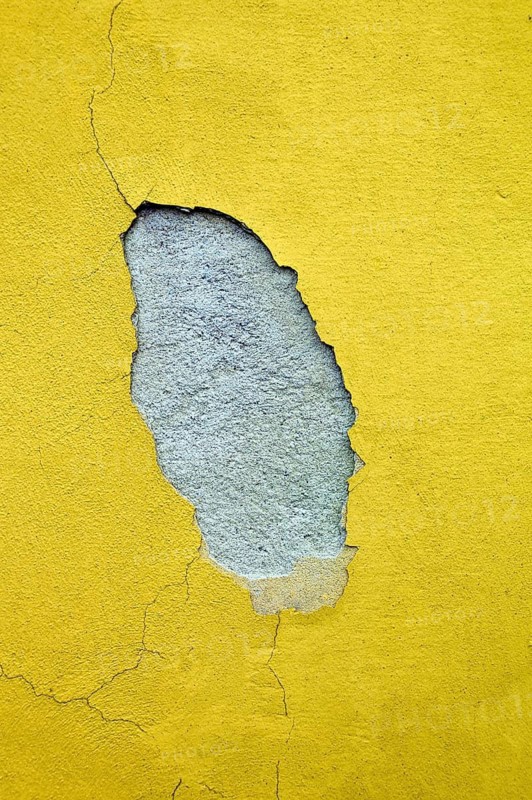 The paint on the façade of a house comes off due to moisture, Austria