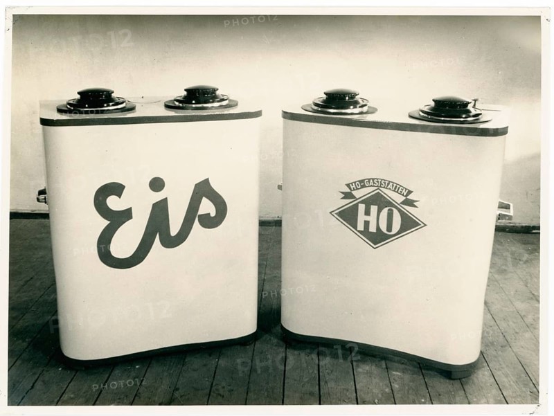 DDR, HO, DDR design, consumption, Two ice cream containers with valves in a simple room on wooden floor in retro style, around 1956