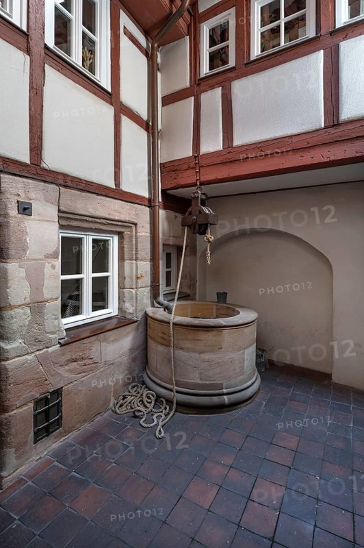 Old fountain in a historic courtyard, Obere Krämergasse 16, Nuremberg, Middle Franconia, Bavaria, Germany
