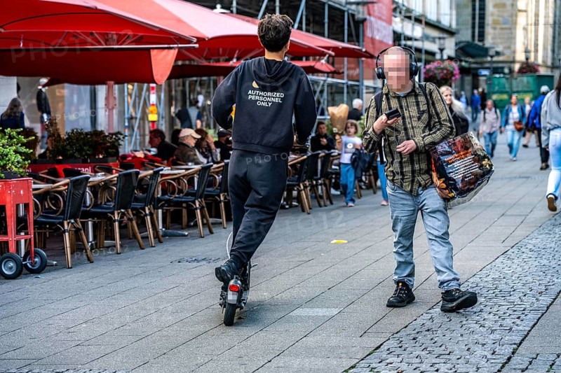 E-scooter in downtown Essen, driving in the Kettwiger Straße pedestrian zone, North Rhine-Westphalia, Germany, private scooter