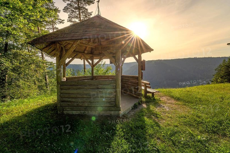 Wooden shelter with sunlight on a mountain meadow, Simmelhütte, Bad Wildbad. germany