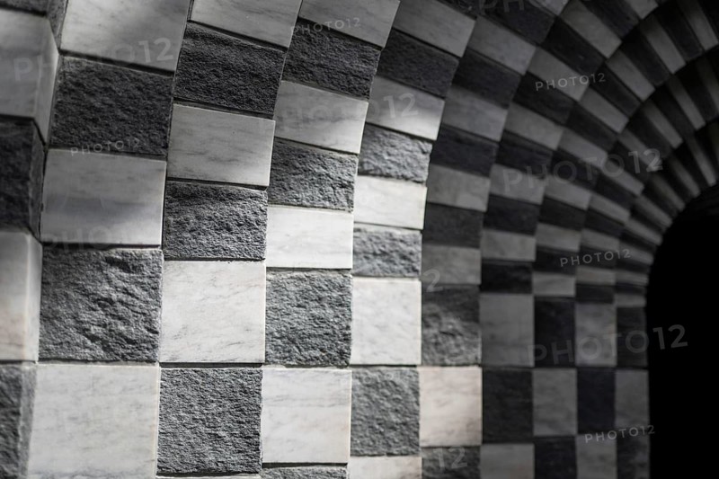 Marble and gneiss alternating in layers, round arch, interior, Roman Catholic church of San Giovanni Battista, built in the same place as the village church destroyed by avalanche in 1986, architect Mario Botta, Mogno, Maggia Valley, Valle Maggia, municipality of Lavizzara, Canton of Tessin, Switzerland