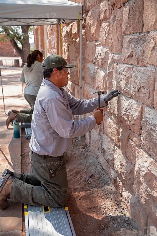 Ganado, Arizona - National Park Service workers repair the wall of the visitor center at the Hubbell Trading Post National Historic Site