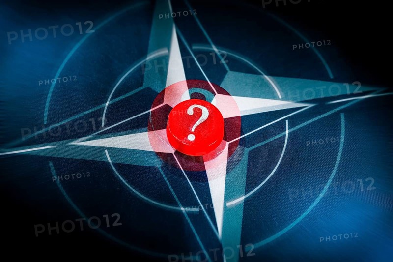 NATO flag with question mark, photo montage +++ editorial use only