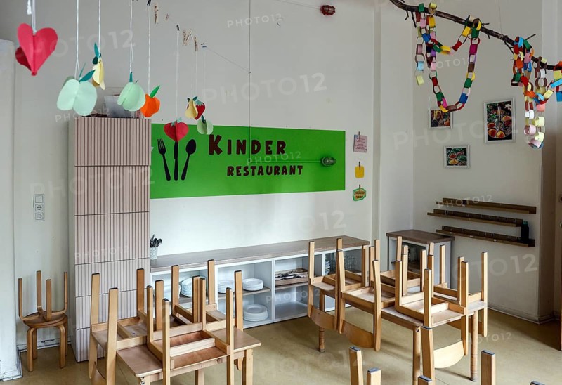 High-standing wooden chairs in the children's restaurant of a daycare center, Berlin, 11.08.2026, Germany