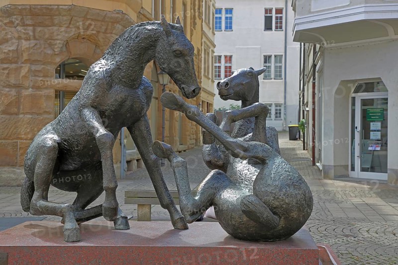Sculpture Playing Horses by Joachim Hering 1991, modern art, bronze sculpture, life-size, two, horse figures, lying on their backs, movement, Rossmarkt, Zeitz, Saxony-Anhalt, Germany