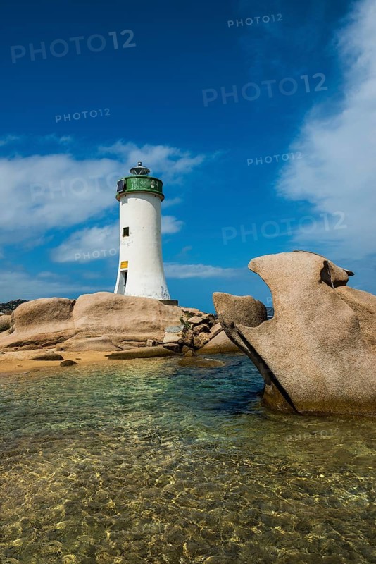 Lighthouse with beach and bizarre granite rocks, Spiaggia Porto Faro, Faro di Punta Palau, Palau, Costa Smeralda, Sardinia, Italy