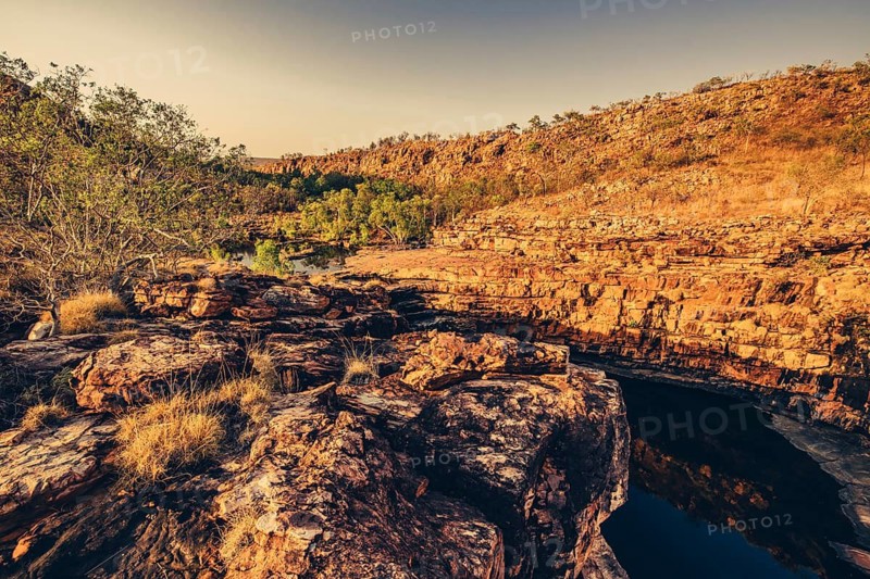 Bell Gorge waterfall, a body of water in north-west Australia in the Kimberley. Sunrise in the outback, Australia