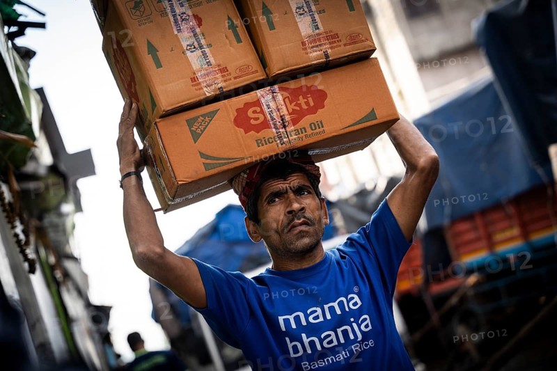 GUWAHATI, INDIA - MAY 1: Labourers carries goods in a wholesale market, in Guwahati, India, on May 1, 2025. May Day or Workers Day is a global holiday celebrated on May 1st to honor workers and their contributions