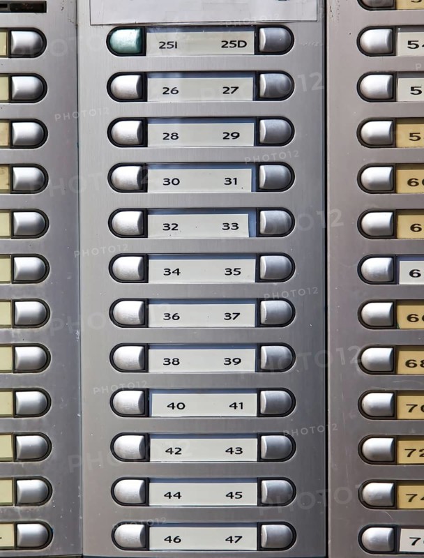 Many numbered doorbells in a residential building, Austria