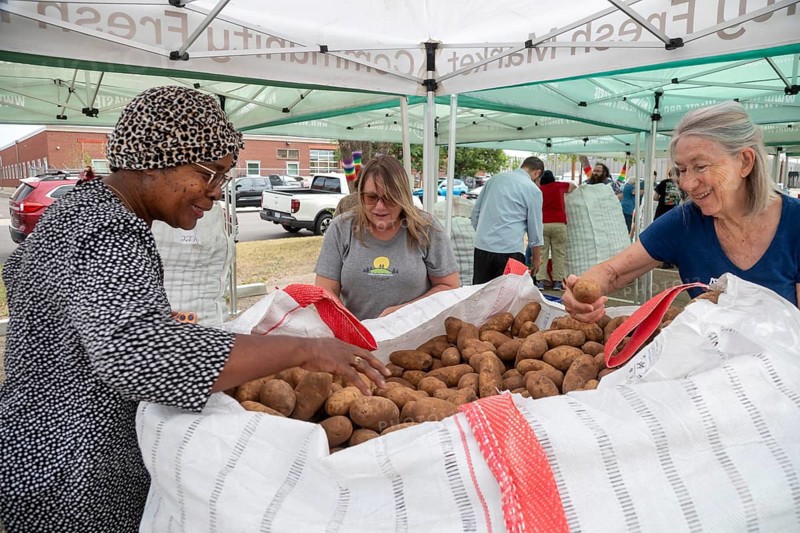Denver, Colorado - The nonprofit We Don't Waste distributes 21 tons of surplus potatoes to area residents. The organization collects food that would otherwise be sent to landfills and distributes it to those who need it