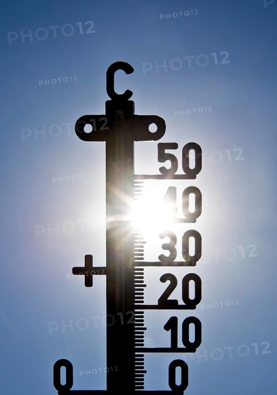 Thermometer shows heat in blazing sun and cloudless sky, symbolic image, summer 2026, Witten, North Rhine-Westphalia, Germany