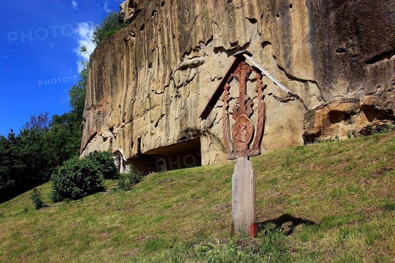 Corbii de Piatra rock monastery, stone ravens carved into a massive, 30-meter high sandstone wall, village of Jgheaburi, municipality of Corbi, in the district of Argesin, Wallachia, Romania