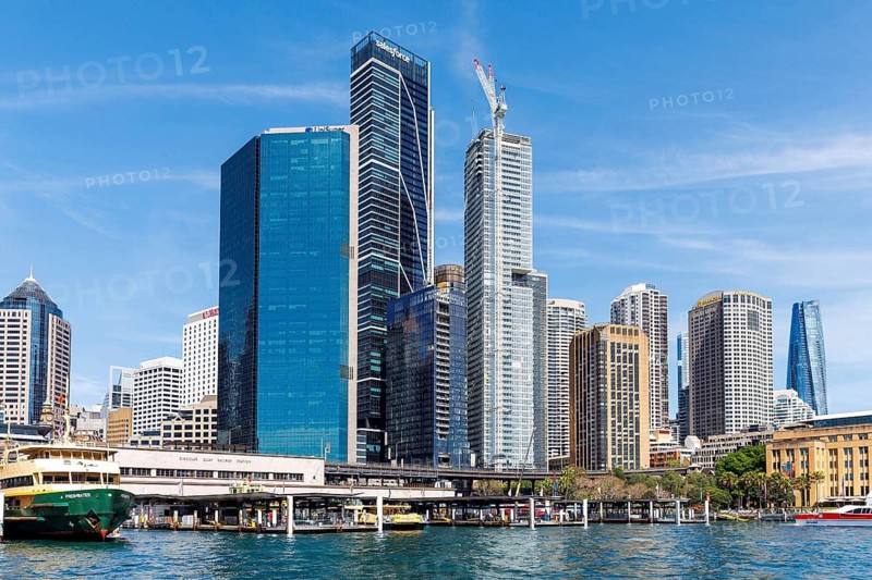 Tall skyscrapers of the CBD rise above the Circular Quay Ferry Terminal, Sydney, Australia