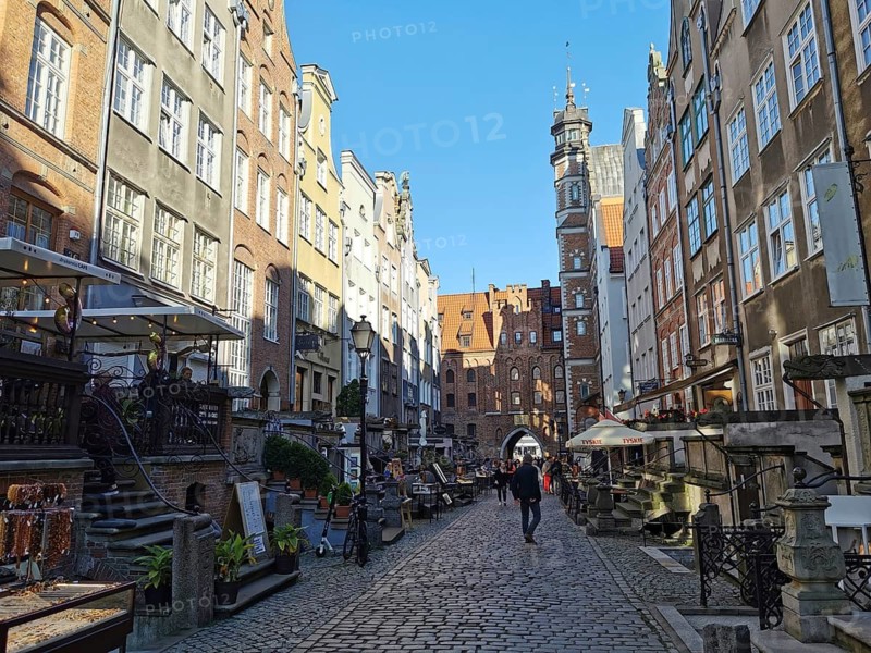 Mariengasse in Gdansk, busy paved alleyway with historic buildings under sunny sky, Gdansk, Poland