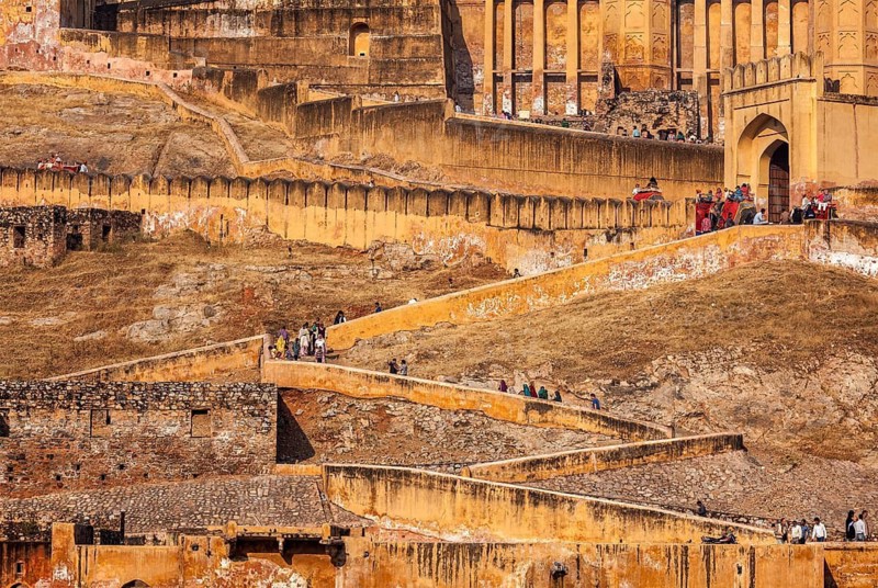 AMER, INDIA, NOVEMBER 18, 2012: Visitors ascending to Amer (Amber) fort. Amer (near Jaipur), Rajasthan, India
