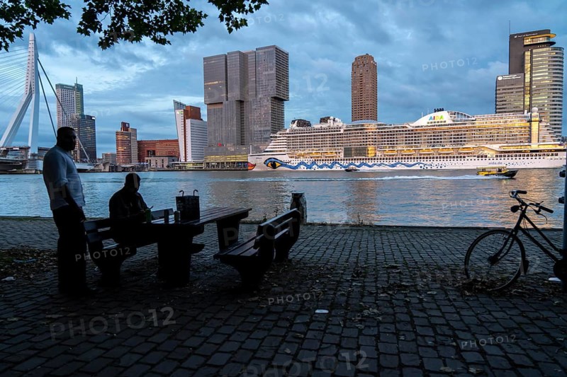 Rotterdam, skyline at the Nieuwe Maas, Erasmus Bridge, skyscrapers at the Kop van Zuid district, cruise ship Aida Prima at the cruise terminal, Netherlands, promenade