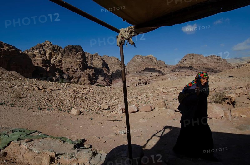 Petra, Jordan. December 11th 2012 A Jordanian Bedouin woman near a monument known as the Pharaohs Penis, Petra, Jordan