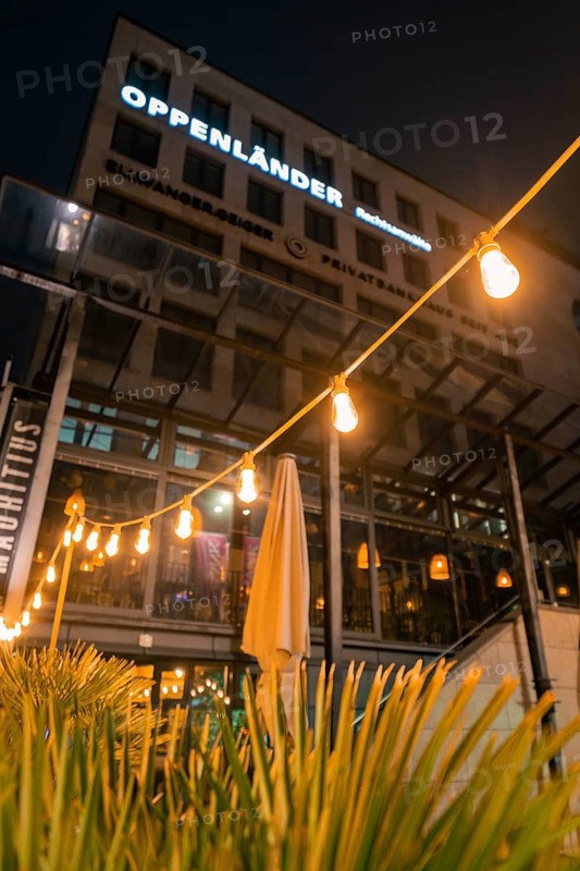 Illuminated restaurant with fairy lights and modern façade at night, Stuttgart, Germany