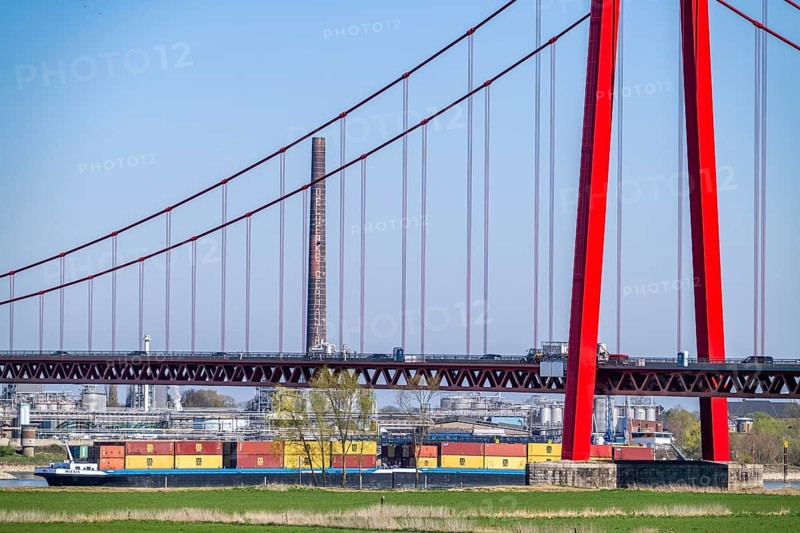 Container cargo ship on the Rhine near Emmerich, travelling towards the Netherlands, Rhine bridge, North Rhine-Westphalia, Germany