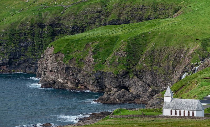Church on steep rocky coast, surf, Vidareidi, Vidoy Island, Viðareiði, Viðoy Island, Faroe Islands, Denmark