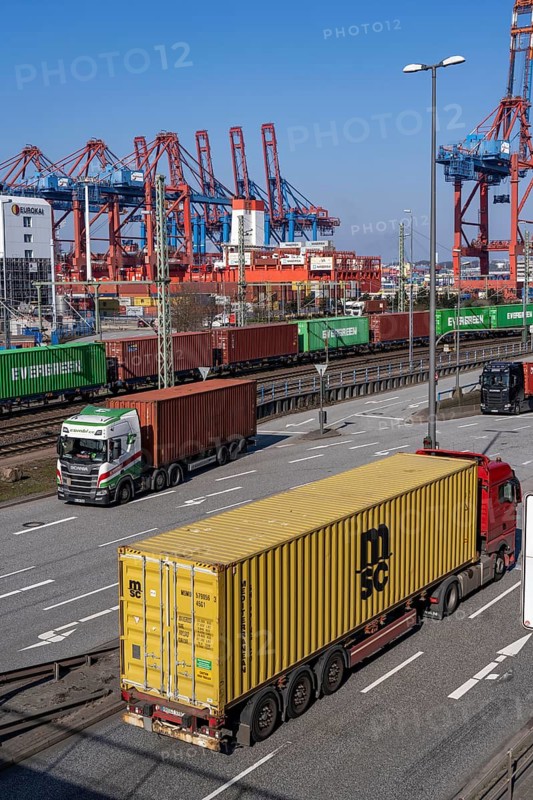 Port of Hamburg, Waltershofer Hafen, container ships, goods train with containers and container lorries bring and collect freight containers to and from HHLA Container Terminal Burchardkai, Hamburg, Germany