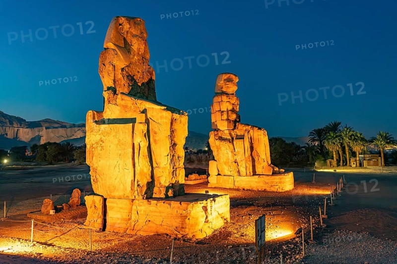 The Colossi of Memnon in the Nile Valley in West Thebes near Luxor at dusk, Egypt