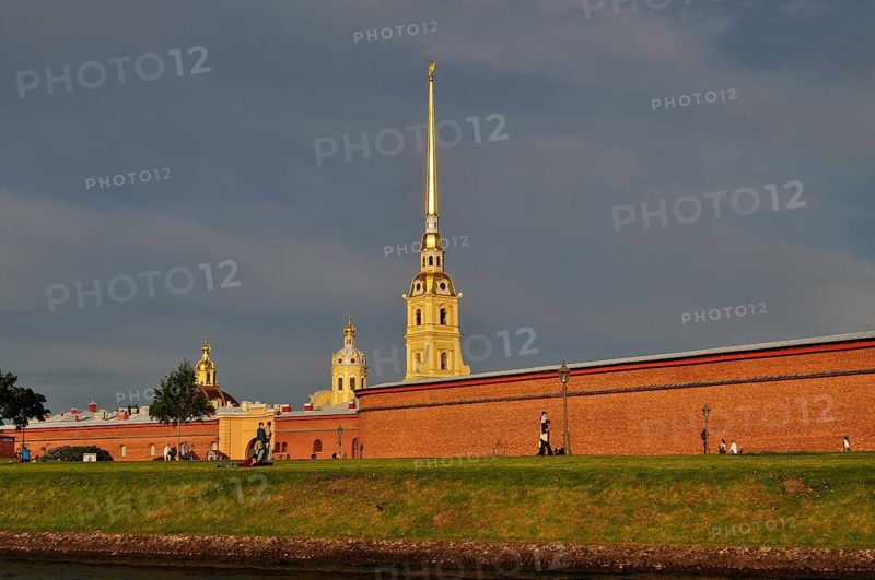 Historic building complex with a tall tower and brick walls under clear skies, Peter and Paul Fortress, Saint Petersburg, St. Petersburg, Russia