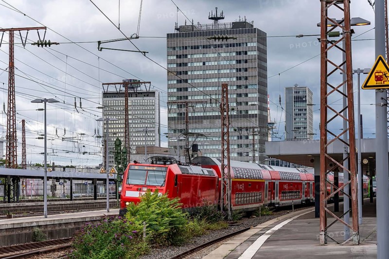 Regional Express, RE2, in Essen main station, city skyline, high-rise office buildings, North Rhine-Westphalia, Germany