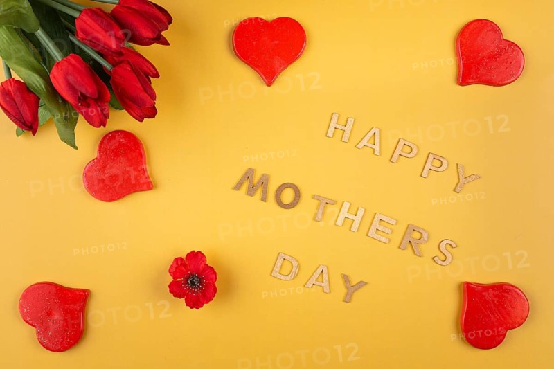 Red tulips and hearts on yellow background with 'Happy Mother's Day' in fonts, Mother's Day