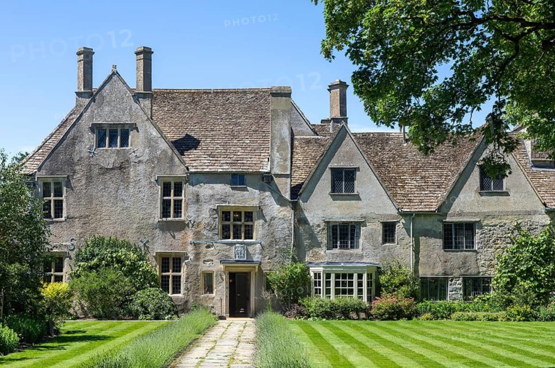 Garden lawn and frontage of historic manor house building, Avebury Manor, Wiltshire, England, UK