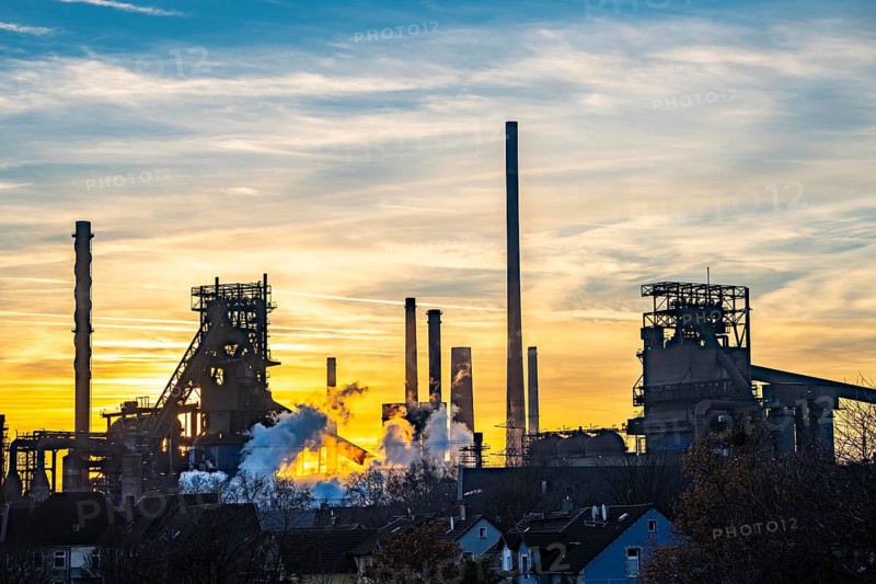 Blast furnace Schwelgern 1 and 2, ThyssenKrupp Steel Schwelgern plant in Duisburg-Marxloh is part of the Bruckhausen steelworks, sunset, North Rhine-Westphalia, Germany