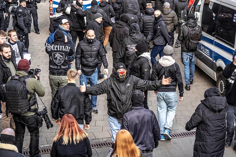 The neo-Nazi group Jung und Stark, JS, demonstrates in the city centre of Essen, demanding the remigration of foreigners, chanting Deutschland den Deutschen Ausländer raus, approx. 150 ultra right-wingers, dressed in black and wearing typical scene clothing, several groups demonstrate against the Nazi march, Essen, North Rhine-Westphalia, Germany