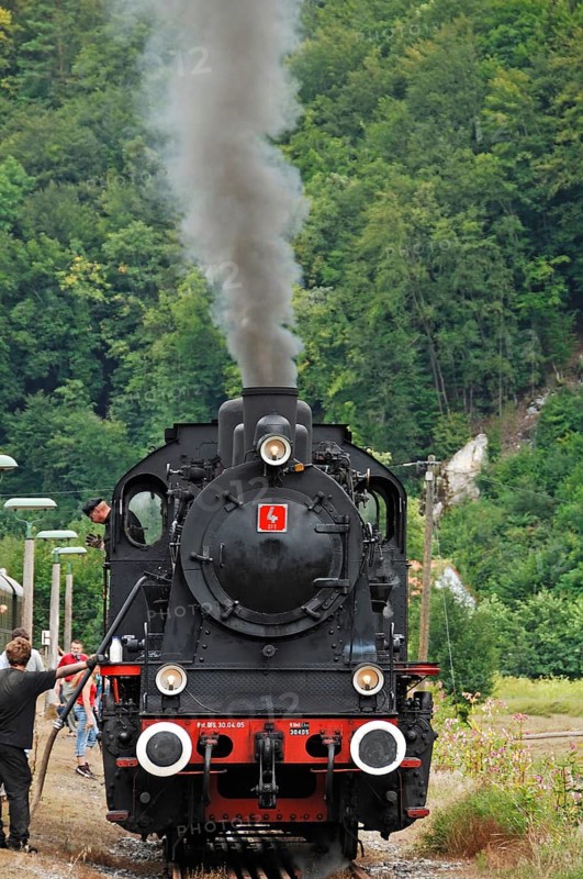 Water intake of a steam locomotive at the train station, special steam locomotive trip in Franconian Switzerland from Ebermannstadt to Muggendorf, Upper Franconia, Germany