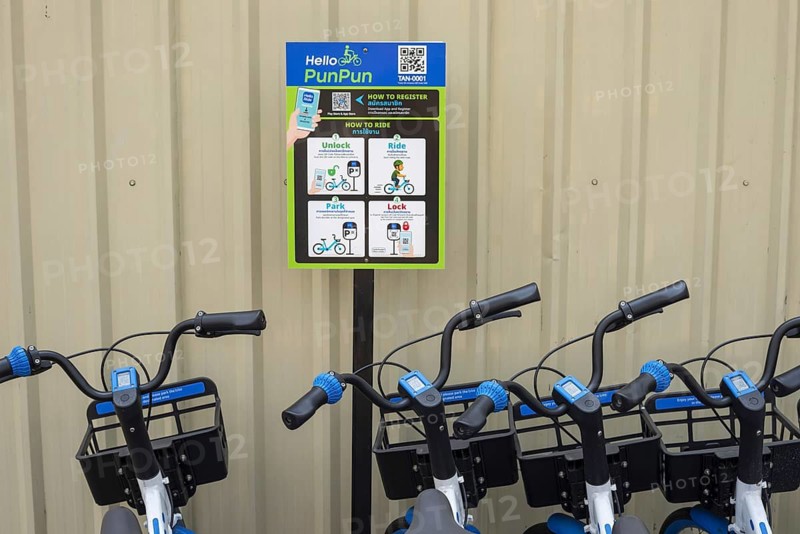 A series of Hello PunPun rental bikes, the blue and white wheels are properly available and show the modern, app-based bike sharing in the historic city center, station in the Phra Nakhon district, Bangkok, Thailand