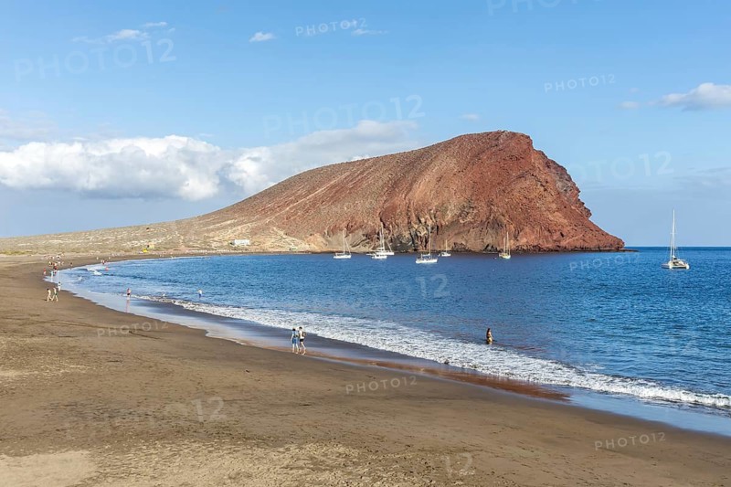 Playa de la Tejita beach with Montana Roja mountain vacation trip in Tenerife La Tejita, Spain