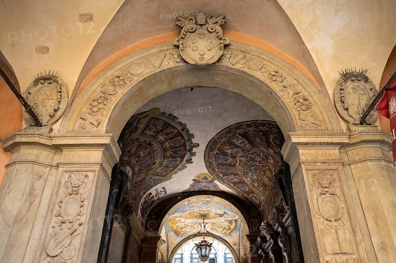 Decorated entrance gate of the Palazzo dell'Archiginnasio, historic former university building, old town, Bologna, Emilia Romagna, Italy
