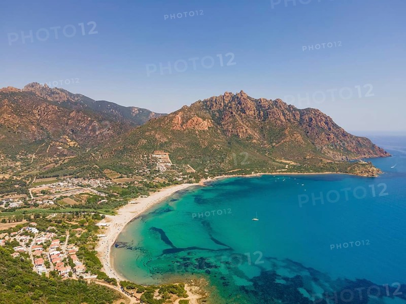 A cloudless blue sky shines over Foxi Manna beach, renowned throughout Europe, in the municipality of Tertenia on the island of Sardinia, Italy. (Aerial view taken by drone), Foxi Manna, Tertenia, Sardinia, Italy