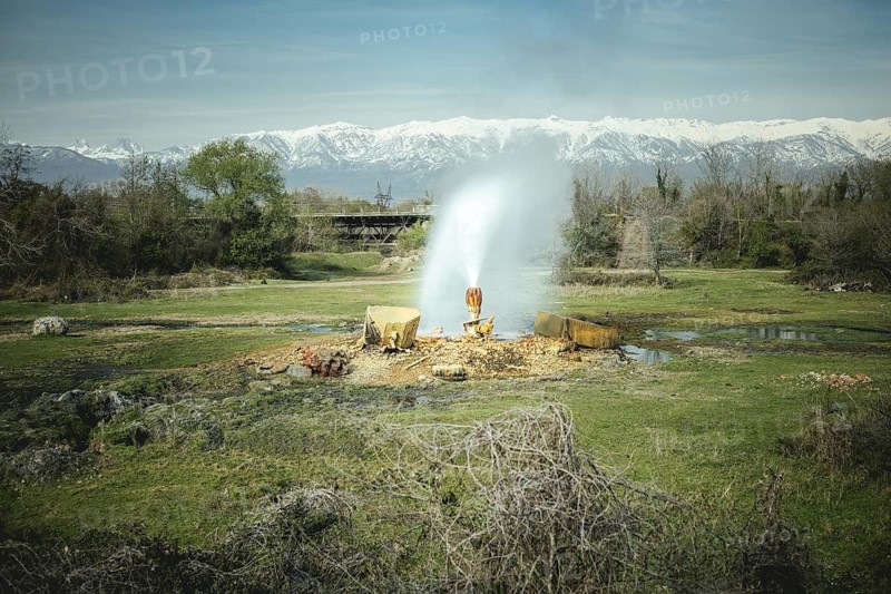 Broken water pipe, in the background Lesser Caucasus, Abkhazia, Georgia