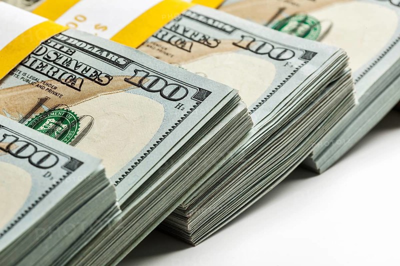 Creative business finance making money concept, background of new 100 US dollars 2013 edition banknotes bills bundles close up