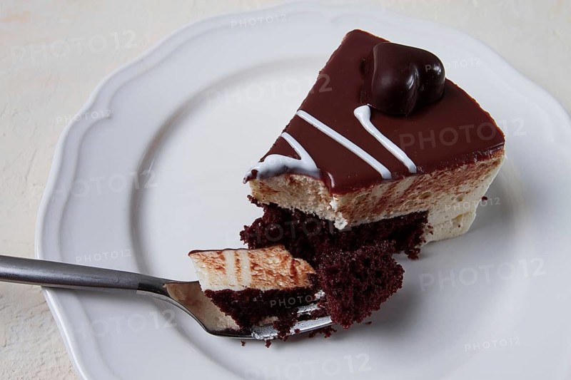 Slice of cake, bird's milk, chocolate sponge cake with souffle, sweet dessert, on a white plate, close-up, horizontal, no people