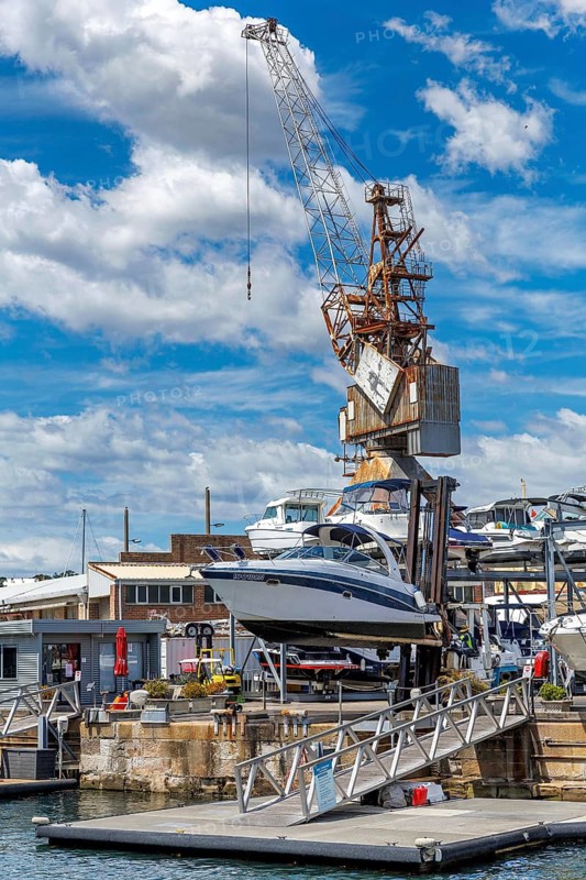 A boat being loaded onto the dry stack at the marina berth on Cockatoo Island, Sydney, Australia